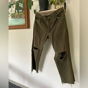 Ripped olive green timberland jeans.